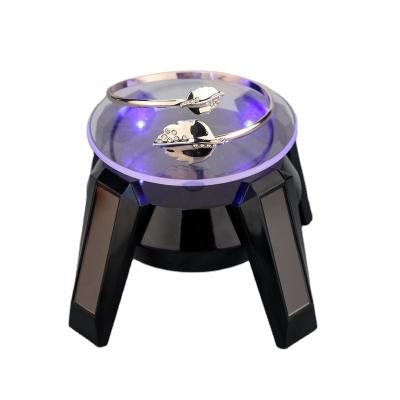 China Plastic / Black Solar Round 360 Rotating Turntable LED Watch Jewelry Display Stand With Leg for sale