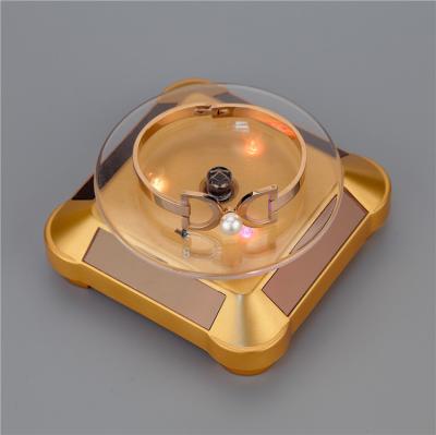 China Portable Square Shape Solar Rotating Display Turntable Jewelry Display For Watch Jade Jewelry Display for sale