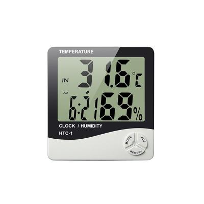 China Function LCD Digital Display Time Wall Hanging Alarm Clock Hygrometer Eco-friendly Pointing Indoor Thermometer for sale