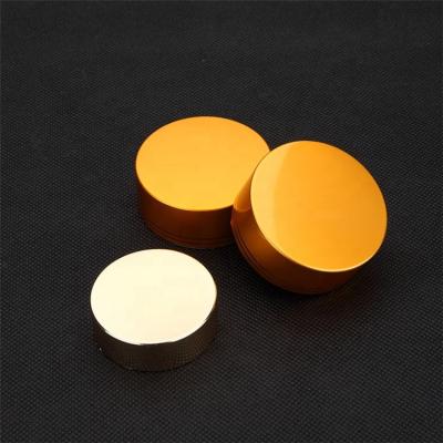 China Customizable Top Cap PP Material 38mm 43mm Gold Twist Child Safe Screw Cap For Pill Bottle for sale