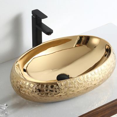 China Bathroom Sink Gold Color Countertop Manufacturer Luxury Oval Ceramic Oval Face Hand Wash Basin for sale