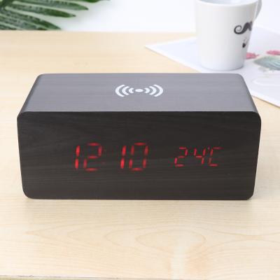 China Multifunctional Wooden Temperature Clock LED Charging Wireless Speaker for sale