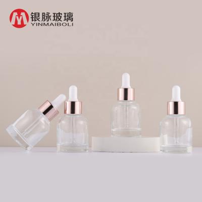 China Beautiful Clear 1 Ounce Personal Care Serum Dropper 30ml Glass Bottles With Rose Gold Dropper Lid for sale