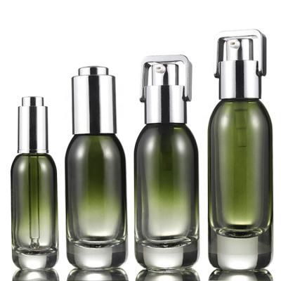 China Personal Care Fancy 30ml 40ml 50ml Green Glass Bottles Sets For Skincare Empty Luxury Packaging for sale