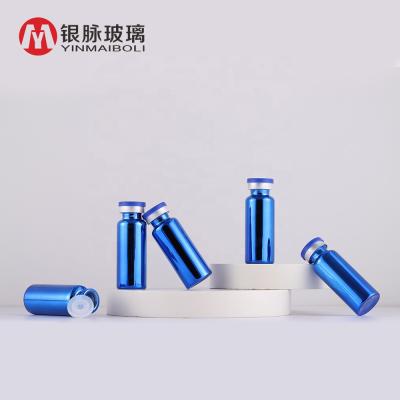 China Hot Sale 5ml 10ml 20ml Mini Personal Care Custom Glass Bottle Transparent Blue Medicinal Vaccine Bottle With Aluminum Plastic Lid for sale