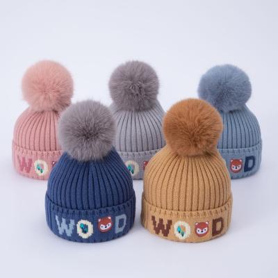 China Custom sublimated beanie hat winter eco-friendly 2-5 years eco-friendly with fur pom kids caps gorros de invierno brand para nino for sale