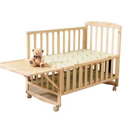 China Eco-friedly Baby Crib Wooden Baby Cradle with Adjustable Bed Board for sale