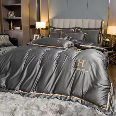 China Home Polyester Luxury Embroidered Washing Silk Bedding Set with Solid Color Duvet Cover for sale