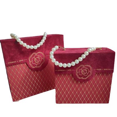 China Creative Gift Box Wedding Candy Box Sweet Box With Ribbon Handle New Chinese Style Decorative Portable Gift Box White&Red for sale