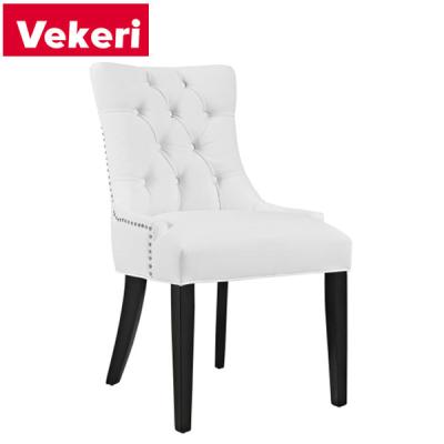 China Modern , Sleek And Stylish Modern White Dining Chair Black Chair Legs Embellished With Shiny Metal Rivets for sale