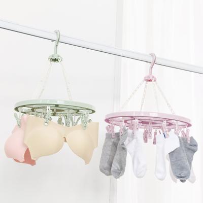 China Eco-friendly Sock Material Round Clip Plastic Drying Rack Rotating Multifunctional Windproof Underwear Baby Diaper Drying Rack for sale