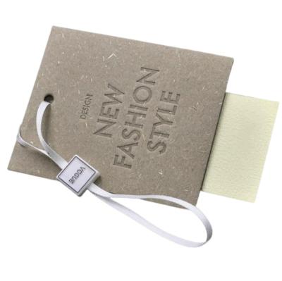 China Viable custom debossing thick logo paper card label apparel hangtag swing tag for sale