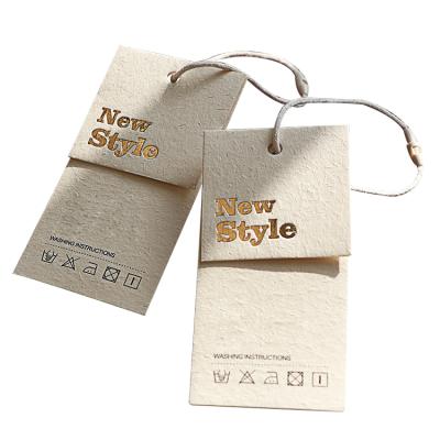 China Custom Made Simple Environmental Label Recyled Swing Label Garment Lady Handbag Hot Stamping Hang Tags for sale