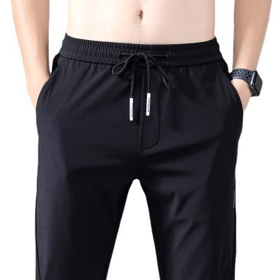 China Amazon low price 3D spandex pocket design sports nylon pants summer slim breathable men's casual pants for sale