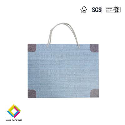 China Luxury Blue Color White Card Paper Bags For Gift Packaging With Ribbon Handle for sale