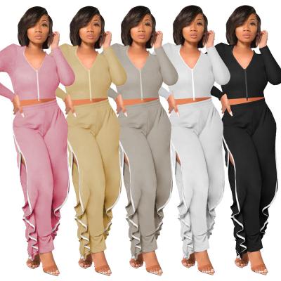 China Fashionable QUICK DRY high quality women's Fall&Winter patterns solid color cotton slim fit zipper pants sports irregular split suit for sale