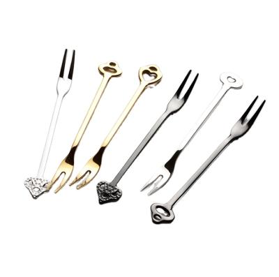 China Luxury Stocked Matte Gold Color Heart Shaped Dinner Table Stainless Steel Spoon Dessert Forks Set for sale