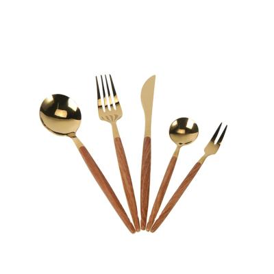 China Stocked Hotel Wedding Household Wood Grain Design Gold Plated Stainless Steel Cutlery Set With ABS Plastic Handle for sale