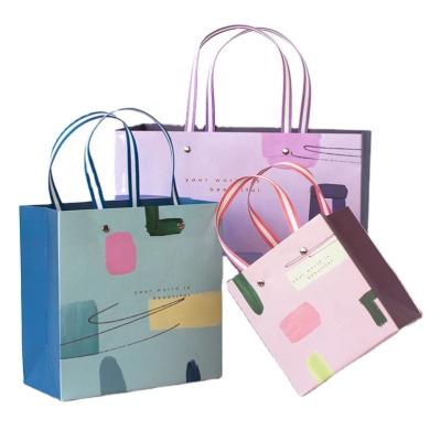 China PomeloHome Handled Packaging Coated Gift Waterproof Metal Handle Carry Paper Shopping Bag for sale