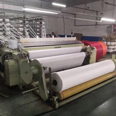 China Water Jet Loom TONGDA pp pe making machine artificial turf primary backing grid cloth machine for sale for sale