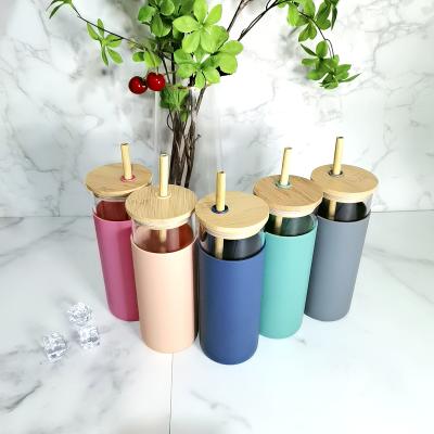 China Wholesale Custom Sustainable Bamboo Sleeve Lid Silicone Glass Water Bottle 500ml Glass Drinks Bottle With Straw for sale