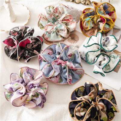 China Relieve Sweet Korean Fashion Hair Scrunchies Flower Pattern Elastic Hair Bands Hair Ties Ponytail Holder For Women Girls Wholesale for sale