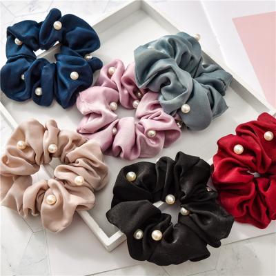 China Relieve Soft Trendy Fashion Stain Silk Hair Scrunchies Pearl Hair Bands Elastic Solid Colorful Ponytail Holder For Women Wholesale for sale