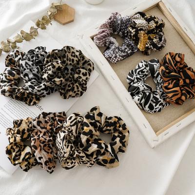 China Relieve Soft Trendy Hair Scrunchies Fashion Leopard Hair Bands Elastic Hair Ties Ponytail Holder For Women Girls Wholesale for sale