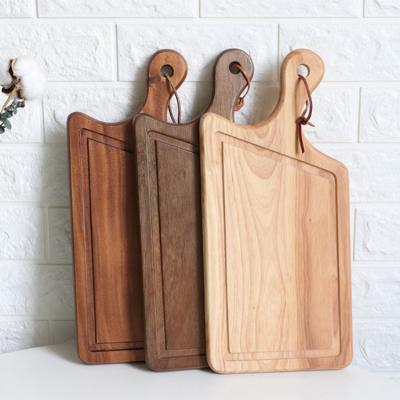 China Viable wooden nut chopper, wooden chopping board with the handle could used as pizza skin, bread board for sale