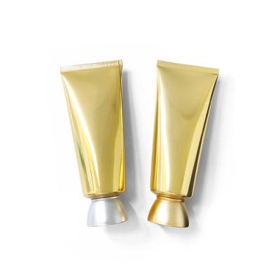 China 100g Customized Highlight 100g Plastic Cosmetic Bottle Cosmetic Detergent Gold Facial Cleanser Tube Hot Sale for sale