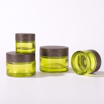 China Wood Grain Cosmetic Cover Manufacturer Direct Selling Luxury Green Skin Care Cream Glass Jars for sale