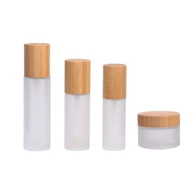 China 30ml 50ml 100ml 120 Pump Spray Bottle Container Lotion Shampoo Bamboo Bottles Natural Bamboo Cosmetic Empty Glass Jar Gel Cap Container for sale