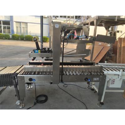 China Automatic Food Folding Cover, Sealer With Band Auxiliary Carton Sealer Packing Machine for sale