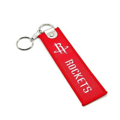 China Portable Hot Sale Embroidered Key Indicator Double Sided Logo Embroidery Key Chain Personalized Fabric Patch Promotional for sale