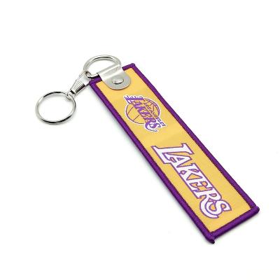 China Portable Wholesale Cheap Custom Metal Lanyard Keychain Woven Logo Embroidery Strap Patch Keyring Brand Name Fabric for sale