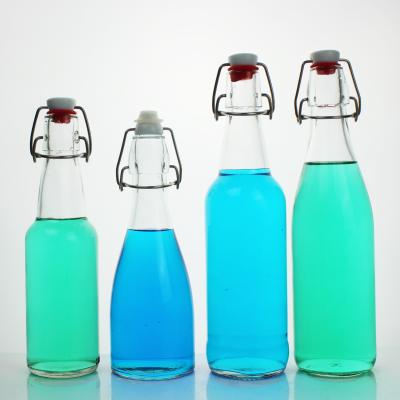 China Eco-friendly Recyclable Good Quality New Design Round Small Beverage Glass Bottle Glass Beverage Bottles Juicy Bottles Beverage Glass for sale