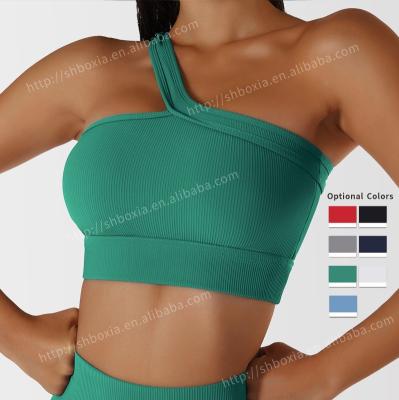 China 2023 Breathable New Design One Shoulder Sports Removable Padded Wireless Yoga Bra Top Yoga Bra Wireless Hot Sexy Fitness Plus Size Gym Yoga Bra for sale