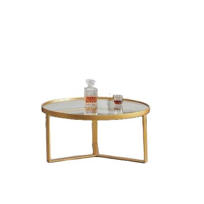 China Single extendable coffee table with gold metal frame and round tempered glass top for sale