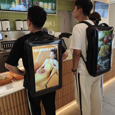 China 21.5 Inch 2nd gen Walking Backpack Screen LCD Displays Digital Signage Menu Advertising Player With Rechargeable Battery en venta