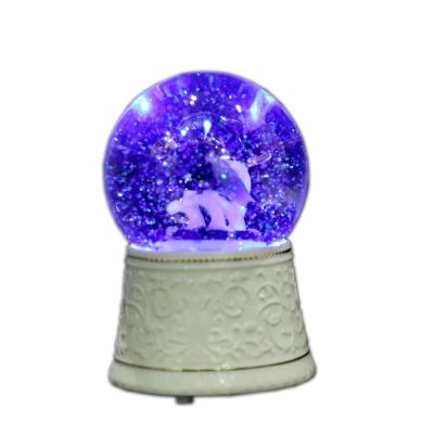 China Retail Snow Crystal Glass Globe Dolphins Gift Factory Resin Base Figurines Inside Music Box With RGB LED Light Change for sale