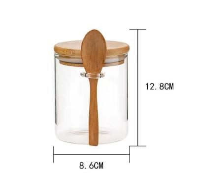 China Sustainable Newcomer Mouth Blown With Bamboo Lid And Wooden Spoon Clear Glass Storage Jar for sale