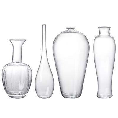 China Modern INS Factory Price Handwork Bottle Shaped Clear Glass Vase For Home Centerpiece for sale