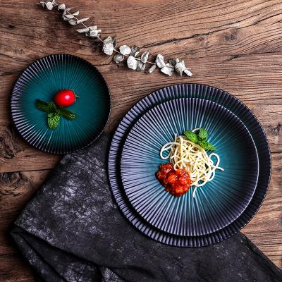 China Sustainable Porcelain Restaurant Sets Durable Ceramic Green Color Glazed Steak Round Ceramic Dish With Black Rim Decor for sale