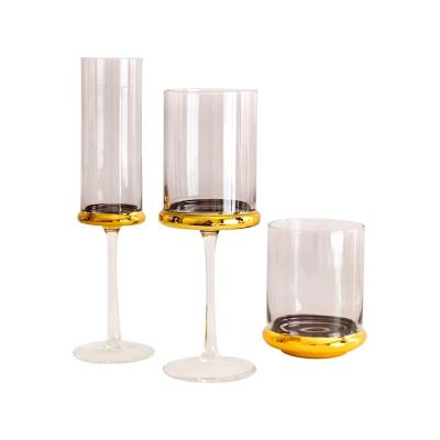 China Fashion Gold Plated European Style Champagne Glasses Household Juice Cups Creative Red High Cylindrical Leg Wine Glass for sale