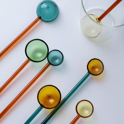 China Beautiful Colorful Transparent High Temperature Resistant Glass Spoon Handle Coffee Stir Round Long Stocked Spoon for sale