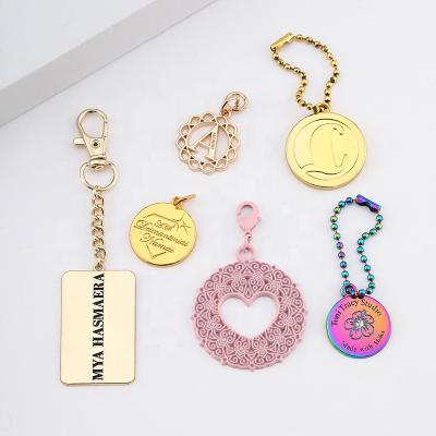 China Washable Round Shape Metal Logo Label Bag Accessories Custom Rectangle Letter Stamped Logo Metal Clothing Hanging Tags With Ball Chain for sale