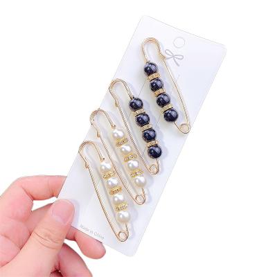 China Women Accessories Crystal Brooch Pins Gold Color Eco-friendly Pearl Stocking Clothing Dress Jewelry Hijab Pins for sale