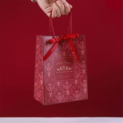 China Cattle Paperboard Custom Kraft Paper Handbag Cosmetics Packaging Gift Bags With Cowhide Rope for sale