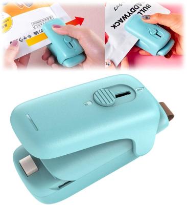 China 2022 New Arrival Portable Handheld Food Saver Plastic Bag Packing Sealing Machine Mini Cutter Sealer For Various Bag for sale