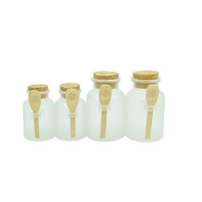 China 100ml 200ml 300ml Cosmetic Bath Salt Bottle ABS Frosted Cork Plastic Bottle Cosmetic Facial Powder Container With Wooden Spoon for sale